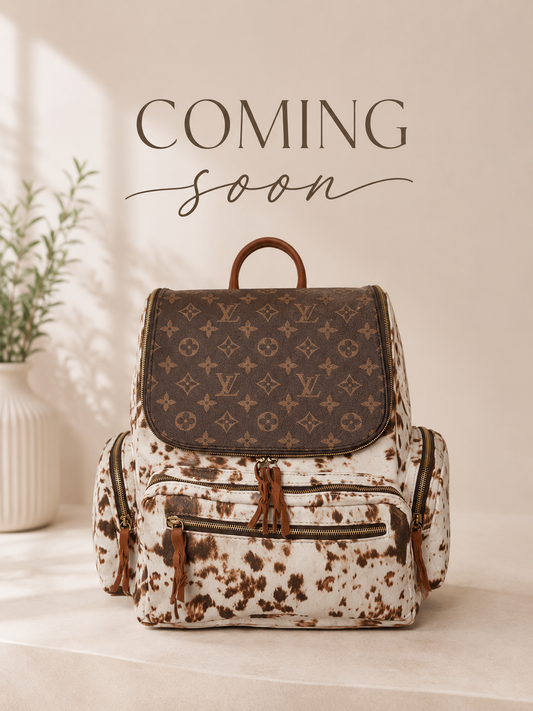 Upcycled Monogram Cowhide Print Backpack